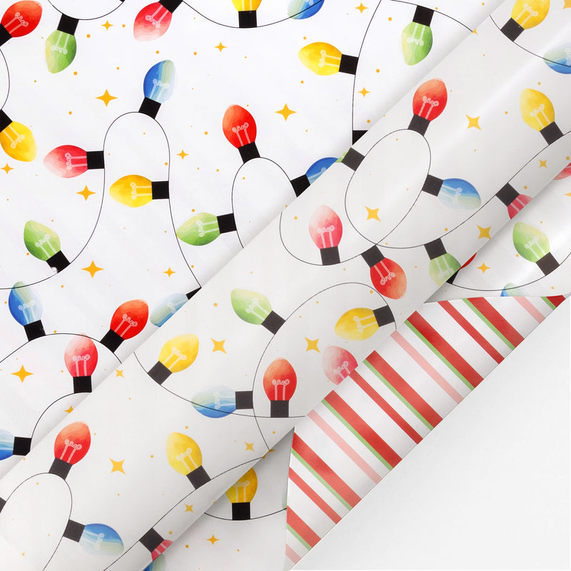 24" x 417' Reversible Holiday Wrapping Paper Half Ream | Festive Lights/Pink and Red on White Diagonal Stripe